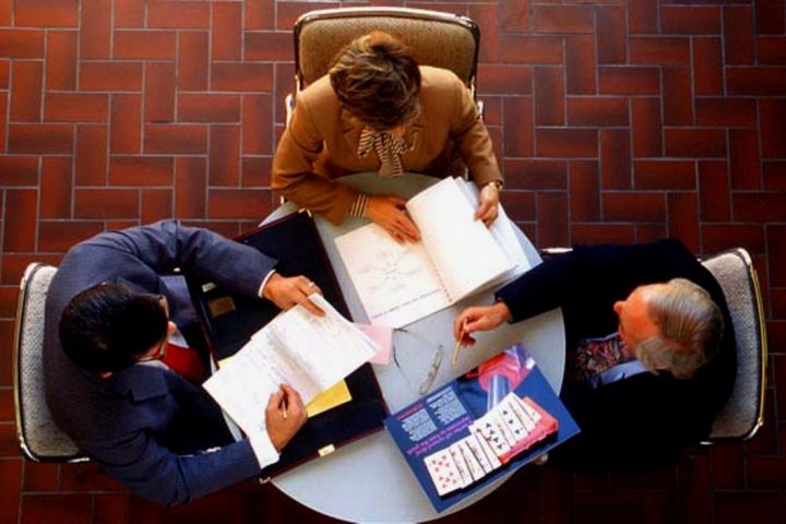 business meeting from above books